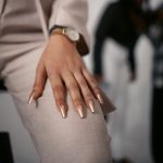 Close-up of a stylish hand pose showcasing fashion and elegance in a studio setting.