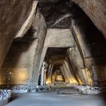 Explore the illuminated ancient cave interiors in Napoli, Italy's archaeological site.