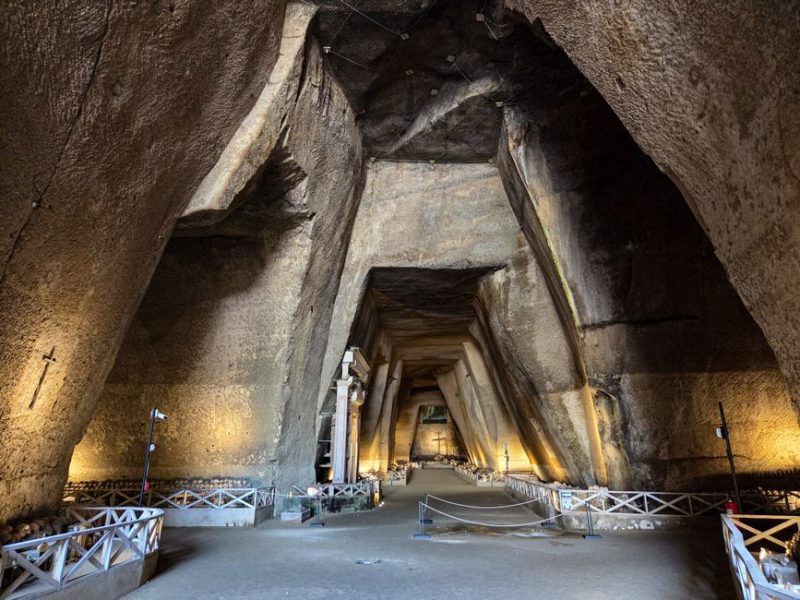 Explore the illuminated ancient cave interiors in Napoli, Italy's archaeological site.